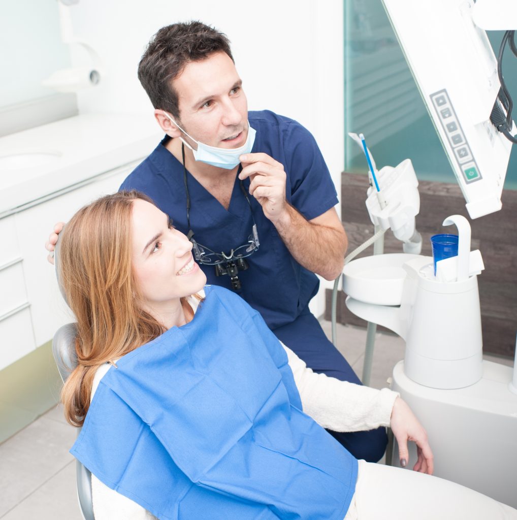 Dentist explaining to a woman