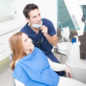  Dentist explaining to a woman