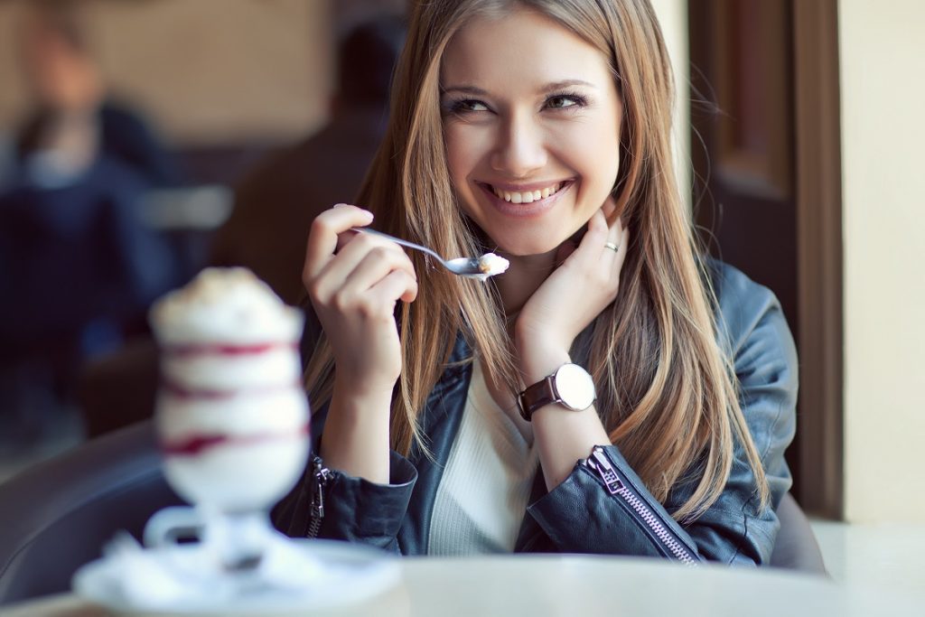 Woman eating a dessert