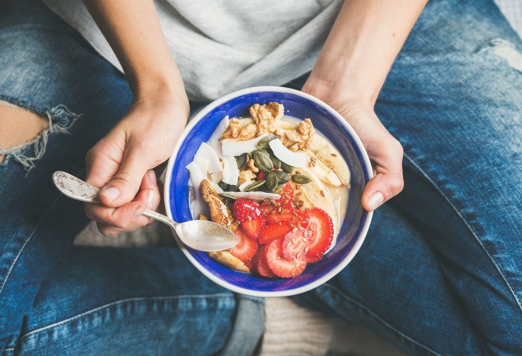 a girl eating a health meal