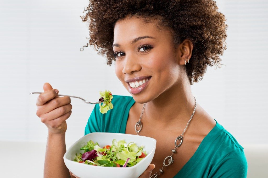 woman eating a salad