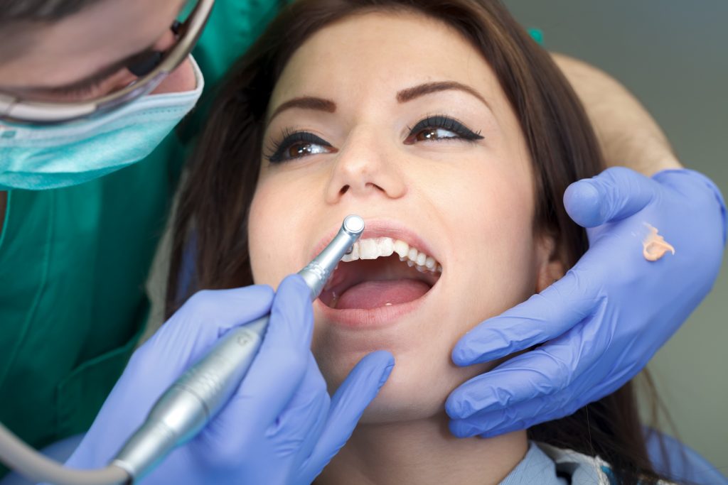 lady undergoing a regular dental checkup