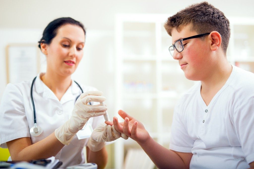 a doctor conducting a blood test