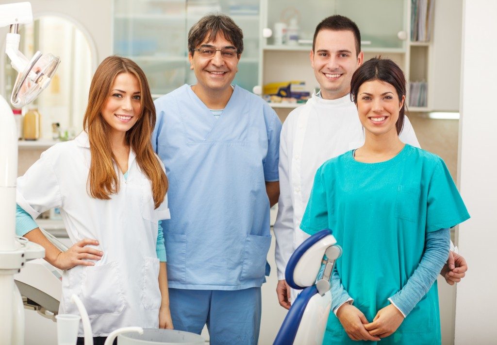Dental team standing in a dental clinic