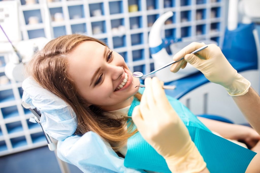 a female patient undergoing dental implant
