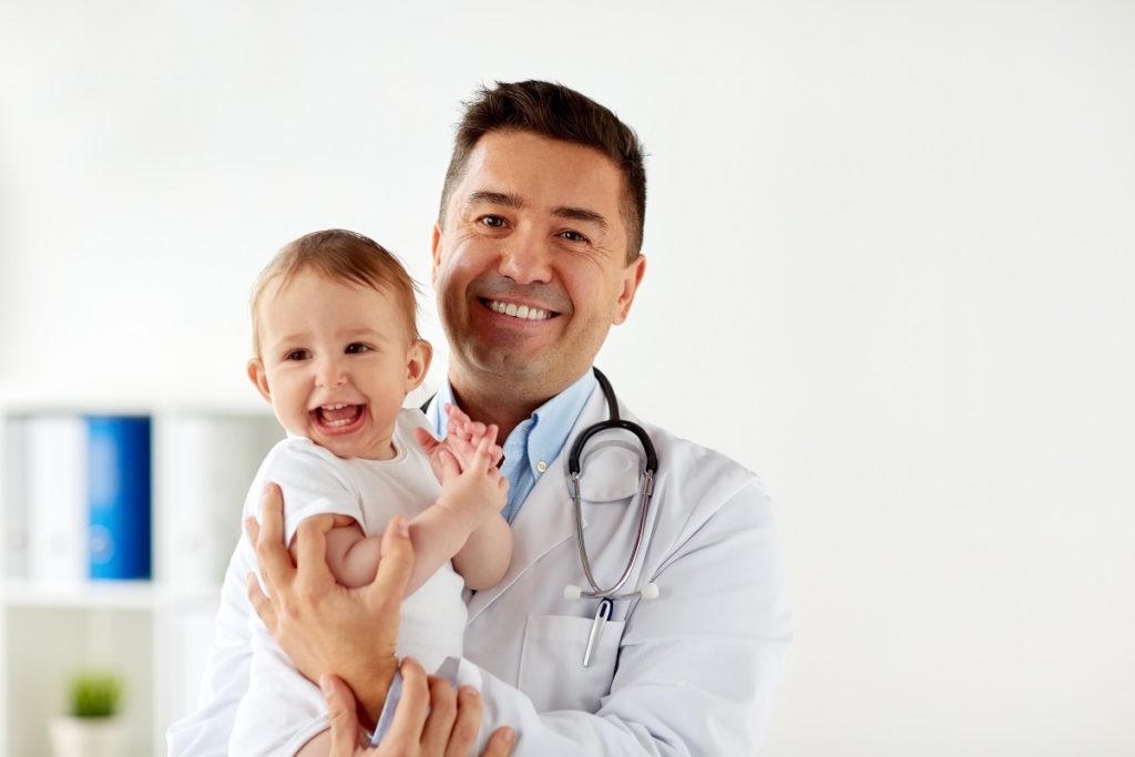Doctor carrying a baby