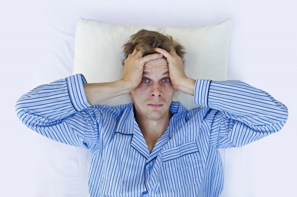 Man having trouble sleeping Man having trouble sleeping