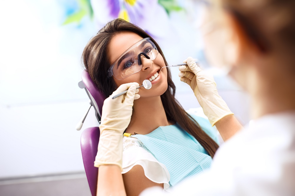Woman having her teeth checked