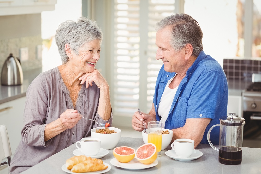 a senior couple having breakfast