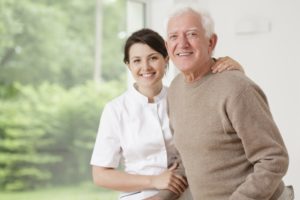 Volunteer taking care of an elder