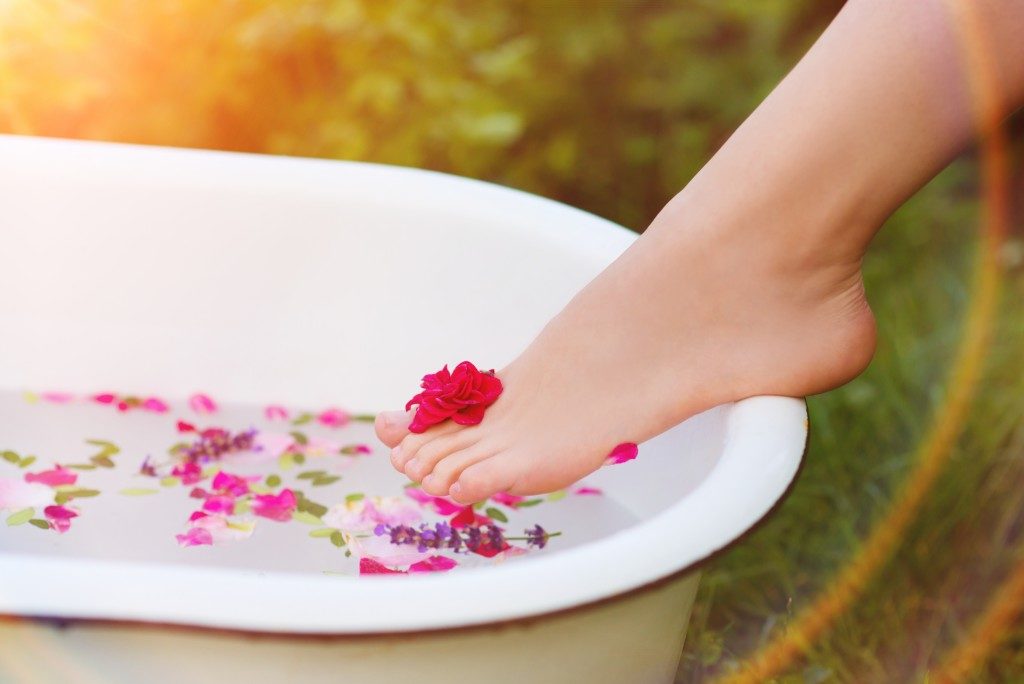 woman taking a herbal bath.