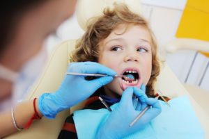Kid looking at the dentist