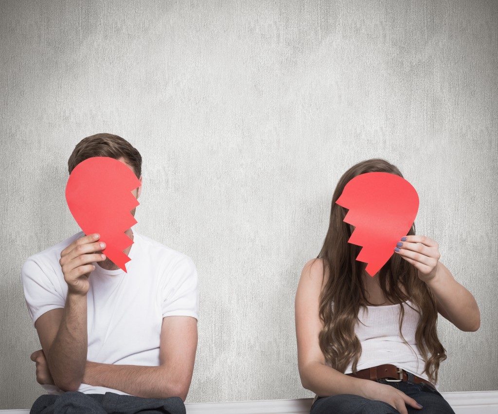 Couple holding broken heart