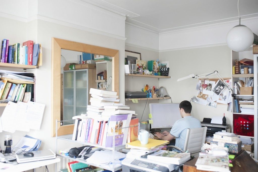 Man working in a cluttered environment