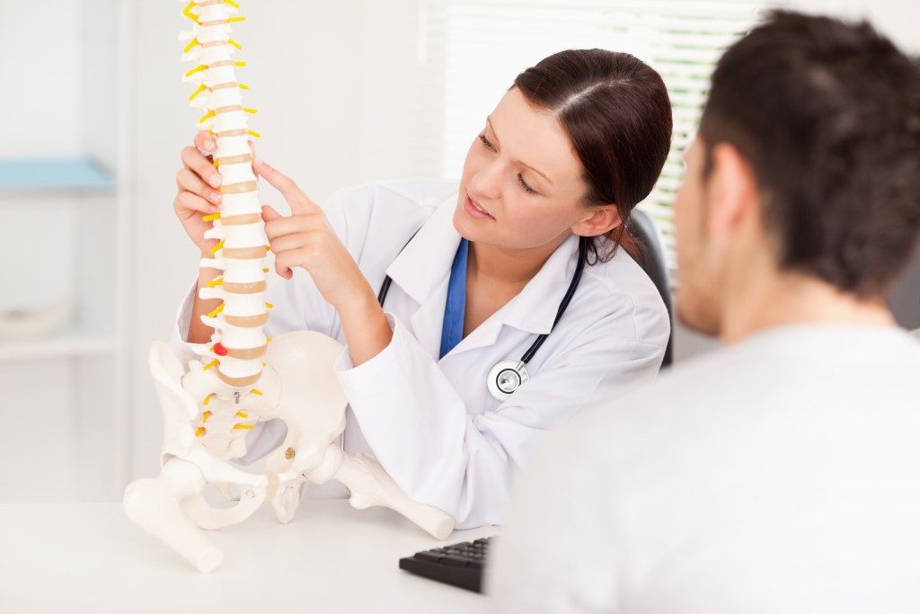 Doctor explaining spine to a patient