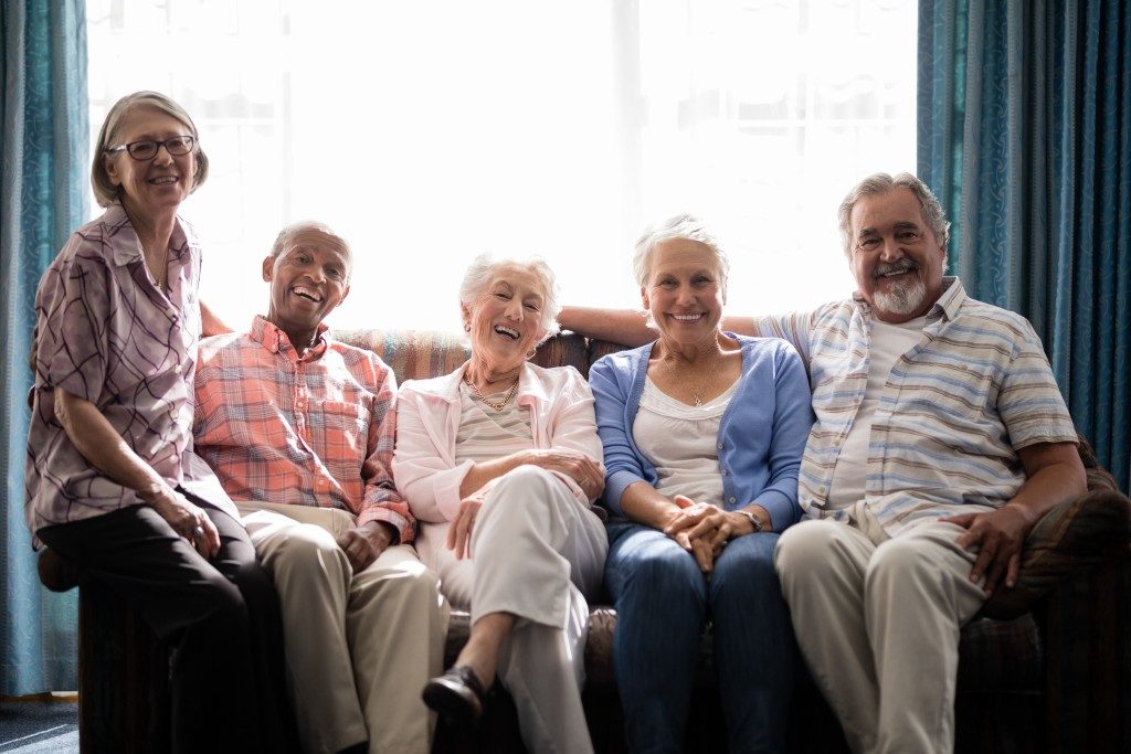 Seniors sitting together on a couch