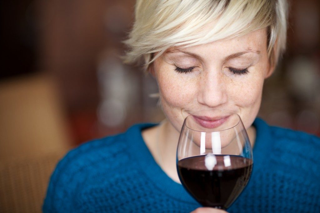 Woman smelling the wine