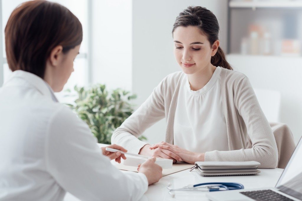 woman consulting with her doctor