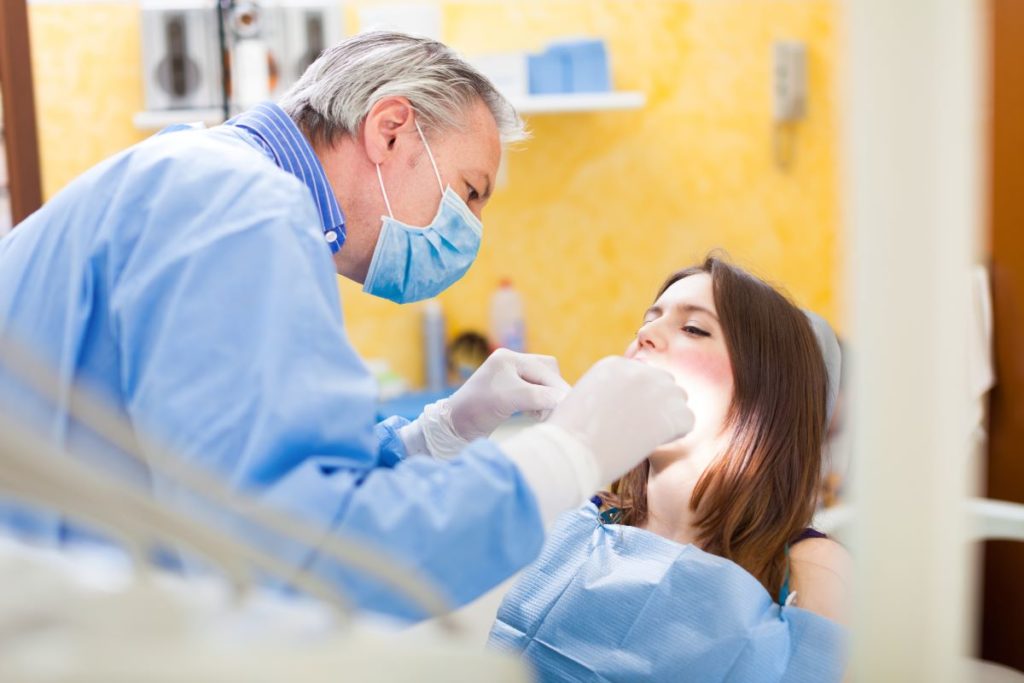 dentist operating on patient