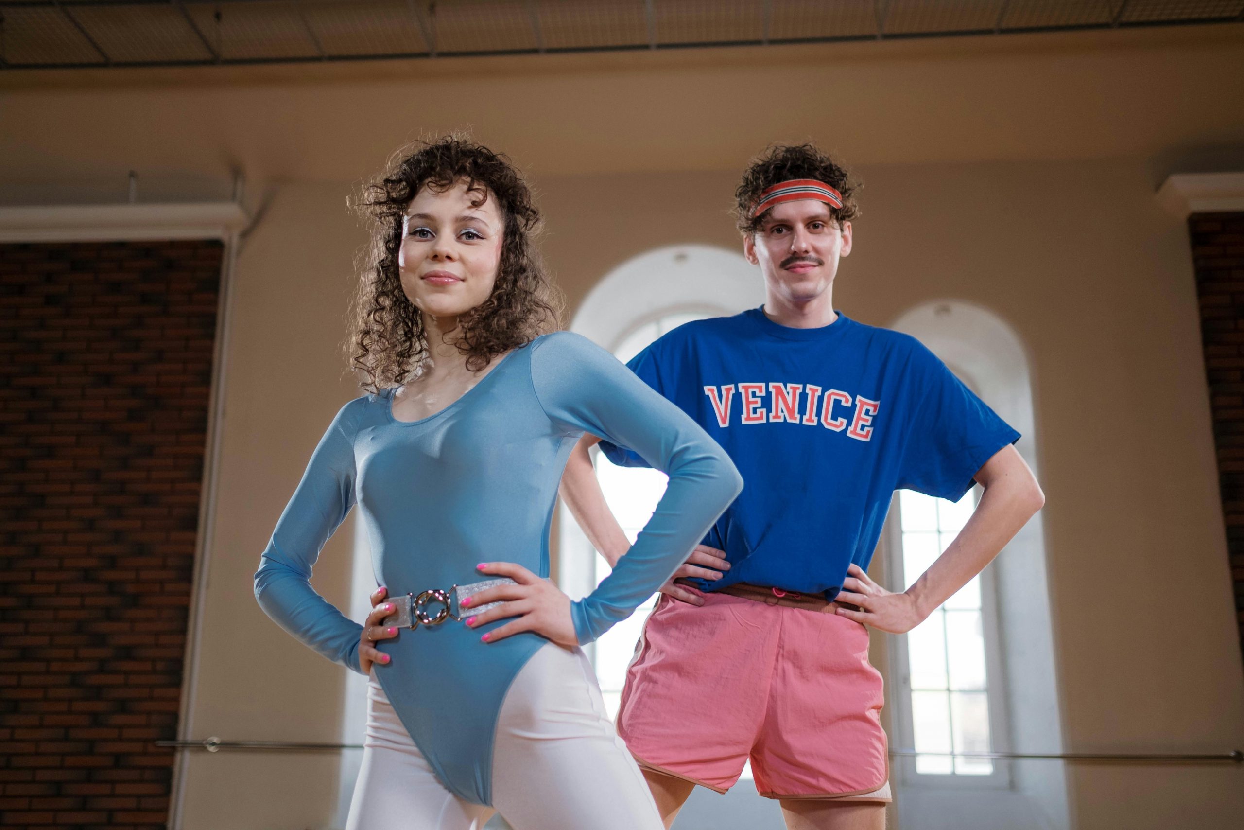 man and woman in 80s activewear